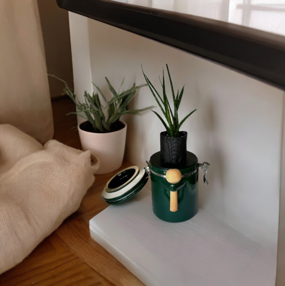 Green "The Market Place" Baking Canister Self Watering Planter with Snake Plant